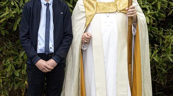 Trevor Dukelow at his Confirmation ceremony with Bishop Paul Colton.