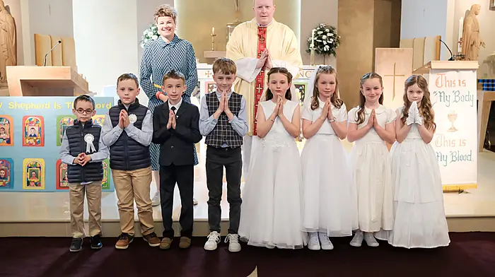 Pupils of Rath National School received their First Holy Communion last Sunday.  Suzy McCarthy (class teacher) and Fr Evin O’ Brien with (from left): Jerry O’Mahony, Cillian O’Mahony, Eóin O’Donovan, Christopher O’Neill, Éirinn O’Driscoll, Kitty Collins, Méabh Collins and Orlaith Brennan.  (Photo: Philip Cullinane)