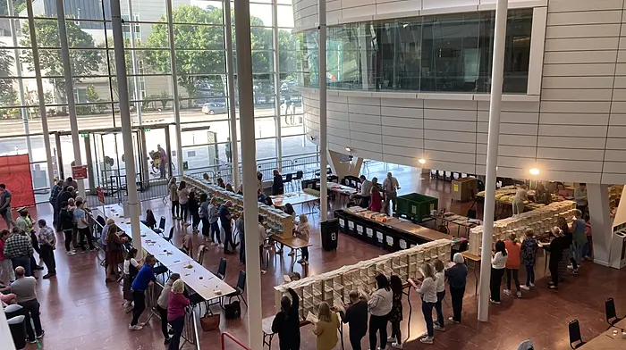 The view from the balcony of the count at County Hall last Saturday where the votes for Carrigaline were counted, which saw Seamus McGrath, below left, top the poll comfortably and Eoin Dalton O'Sullivan, below right, (seen with newly-elected Macroom Cllr Martin Coughlan) come in second.