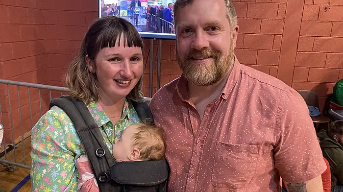 Outgoing Cllr Chris Heinhold with wife Emer and baby Maisie at the count in Clonakilty. Right: Fionn O’Driscoll-Hayes from Schull giving his approval for the count at Clonakilty.  (Fionn photo: Martin Walsh)