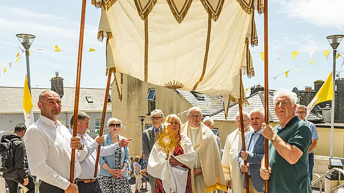 The annual Corpus Christi procession was a historic one in Castletownbere as it was the first time that women, Maureen Power and Ellen Dunne, carried the Monstrance through the town. The procession was officiated by Fr Noel Spring and Fr John Kerin. All the First Holy Communicants from the parish took part in the parade. Back: Johnny Orpen, Maureen Power, John Wiseman, Barry O’Sullivan, Fr John Kerin,  Fr Noel Spring and Liam O’Driscoll.  Front: Krzysztof Chrzanowski, Ellen Dunne and Francis Lehane.   (Photo: Anne Marie Cronin)