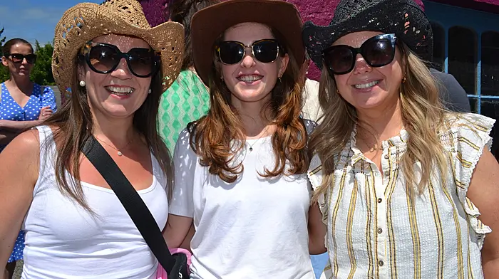 Aine Long from Cork with Ballydehob ladies Eimear and Ciara O'Regan soaking in the sunshine at the Ballydehob Country Music Festival which was held last weekend. (Photo: Anne Minihane)