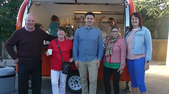Enjoying the coffee from The Crafty Bean at Gaggin Hall ahead of the comedy show were (from left): Donie and Carmel Coomey, Bernard Casey (comedian), Linda O'Connell and Karen O'Sullivan with Vicky Ridgeway and Ellie Stringer hard at work in the truck.