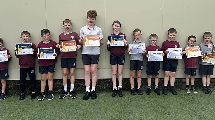 Pupils from Rath National School accepting their gold, silver and bronze attendance awards for missing little or no school days this year. From left: Laura O’Mahony, Éoin O’Donovan, Stephen O’Mahony, Fionn Daly, Senan Whooley, Anna Walsh, Méabh Collins, Eoghan Collins, Cillian O’Mahony, Jerry O’Mahony and Isabelle Sheehy.
