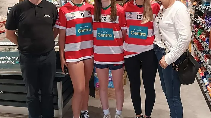 Anto Hegarty of Centra Ballinspittle with (from left): Jess Helbrow, Katie Crowley  and Caoimhe Foley of the Courcey Rovers U16 team and with Catherine Helbrow, chairman of Courcey Rovers camogie and ladies football club, at the launch of the team’s new jerseys which were kindly sponsored by Centra Ballinspittle.