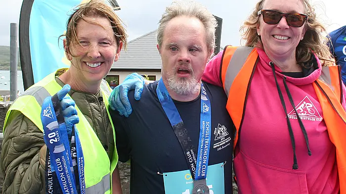 Fineen McCarthy from Schull with hard working marshals Linda Morgan and Deirdre Ni Challanain after the Brosnan's Centra Fastnet Triathlon in Schull.  (Photo: Terry Attridge)