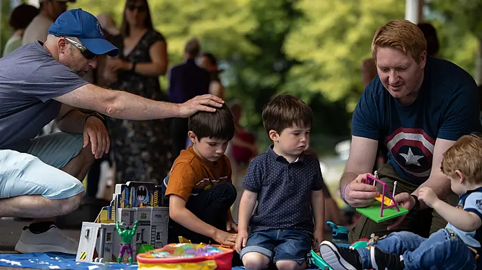 CMK 23062024REPRO FREE NO FEEIreland’s first digital Toy Library launched pictured Padraig Keenan with sons Paul and Charlie Keenan enjoying Padraig O’Connel’’s son Lucas’ toys. Lucas is living with Cystic Fibrosis and  at a special toy swap event in Carrigaline Park, Cork. Launched today, TheToyLibrary.ie aims to revolutionise the way families and children access toys in communities across Ireland. The Toy Library offers a free way for families to refresh toy collections without spending money and reduce waste by giving unwanted toys a new lease of life.  Picture: Clare KeoghFor media queries: contact Kate O’Sullivan on kateosullivan@ucc.ie.