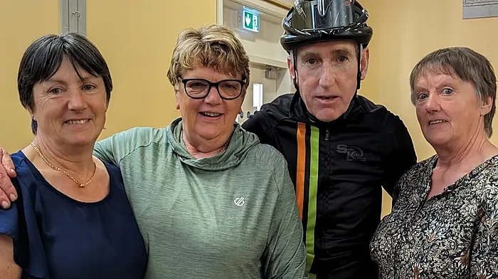 The three O’Brien sisters (from left) Mary Collins, Noreen Desmond and Margaret O’Brien volunteering at the charity cycle which passed through Ballinspittle and where they met renowned cyclist Sean Kelly.