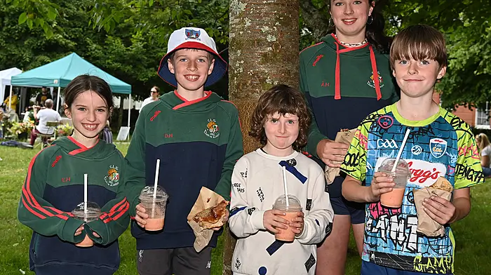 Enjoying some food at the Friday market in Kennedy Gardens were (left to right): Eimear Hennessy, Darragh Hennessy, Mia Brooks-Griffin, Áine Hennessy and Ewan Brooks-Griffin, all from Clonakilty.  Photo: Martin Walsh.