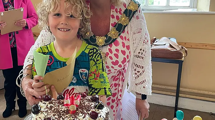 Jerry Mc Carthy, who won the U12 adjudicators prize, at the Clonakilty Macra Bake Off with master judge Mayor Eileen Sheppard. 