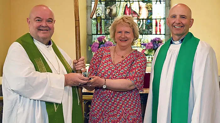 Bishop Paul Colton (Church of Ireland Bishop of Cork, Cloyne and Ross) receives a presentation from Violet Kingston to mark his Silver Jubilee and also his visit to St. John’s Church, Courtmacsherry on Sunday last.  Also included is Reverend Kingsley Sutton (Kilgariffe Union of Parishes).  Photo: Martin Walsh.