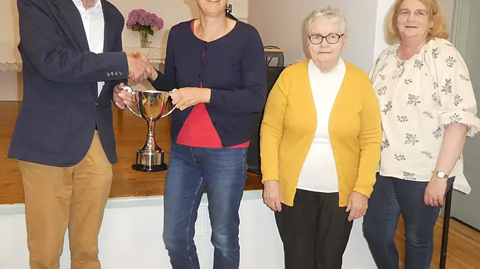 Kevin O'Sullivan presenting the John O'Sullivan memorial cup to Shirley Shannon who was winner of the recent festival car treasure hunt. Also included are Ann O'Sullivan and Claire Deasy.