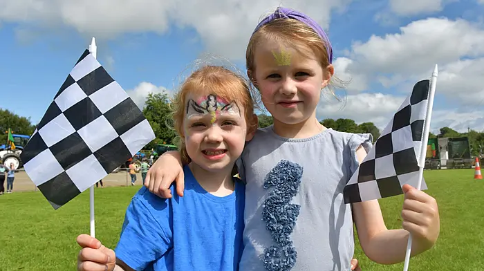 Sisters Isla and Tírna Stephenson from Bantry who were supporting their dad Tony in the Leap Fitpit Challenge at the family fun day at Kilmacabea GAA grounds last weekend. (Photo: Anne Minihane)