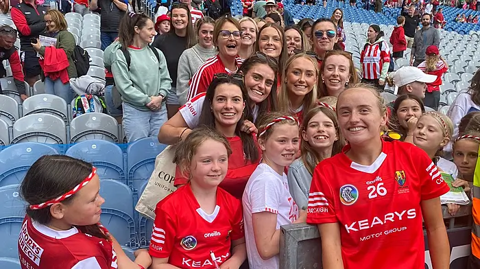 Millie Condon with her Ballinascarthy fan club who travelled to Croke Park for the All-Ireland senior camogie final.