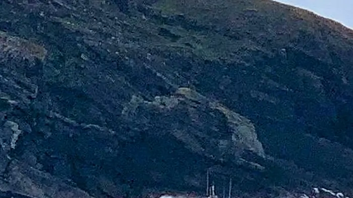 The Castletownbere RNLI lifeboat, the Annette Hutton, rounding the Ardnakinna Lighthouse at the mouth of Castletownbere harbour.