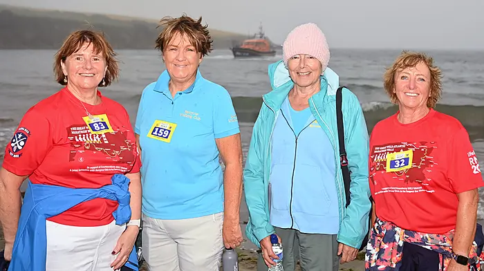 Ann Murphy from Lislevane, Eithne Lordan from Clonakilty, Helen Crilly from  Clonakilty and Noreen Fleming from the Seven Heads at Broadstarnd, Courmacsherry during the Great Wild Atlantic Marathon Walk last Sunday.   The Shannon-class RNLB Val Adnams can be seen in the background. (Photo: Martin Walsh)