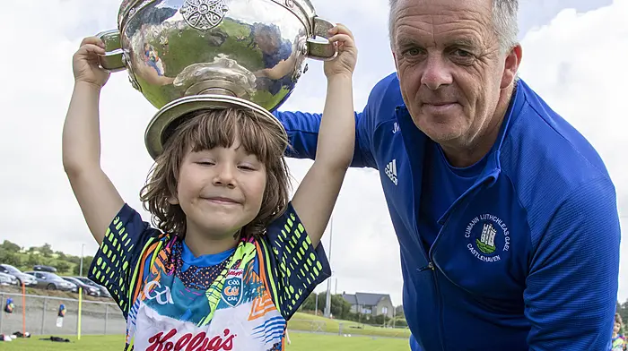 Castlehaven GAA Moneyvollahane Pitch. Friday 09th August 2024Castlehaven held their 2024 Cul Camp this week with a huge turnout of 180 children. Here image an of Ciara Coughlan holding up the Andy Scannell Cup with James McCarthy. James was the manager of the Senior Men who lead them to win the cup last year.Credit: Andrew Harris