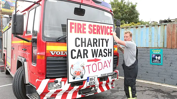 Brian O'Callaghan, member of Schull Fire and Rescue, at the charity car wash which was held at Brosnan’s car park in Schull in aid of Barretstown.  (Photo: Carlos Benlayo)