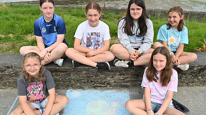 Local girls at the chalk drawing competition during the Courtmacsherry Harbour Festival were (back, from left) Amy Whelton, Sarah Madden, Faye Knowles and Darcy O’Donovan.  Front (from left) Remi O’Donovan and Katie May O’Driscoll.  (Photo: Martin Walsh)