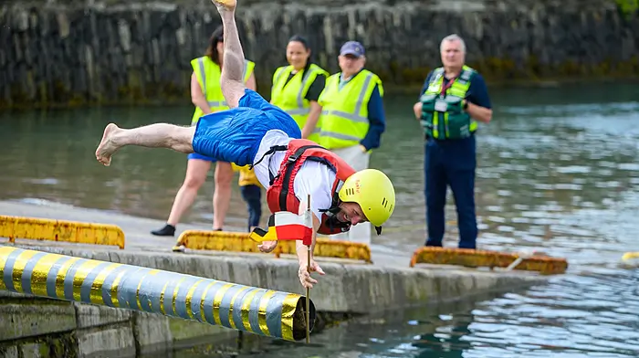 John O’Driscoll from Kinsale leaping for the flag during the Kinsale Regatta water carnival’s slippery pole event over the bank holiday weekend. (Photo: John Allen)