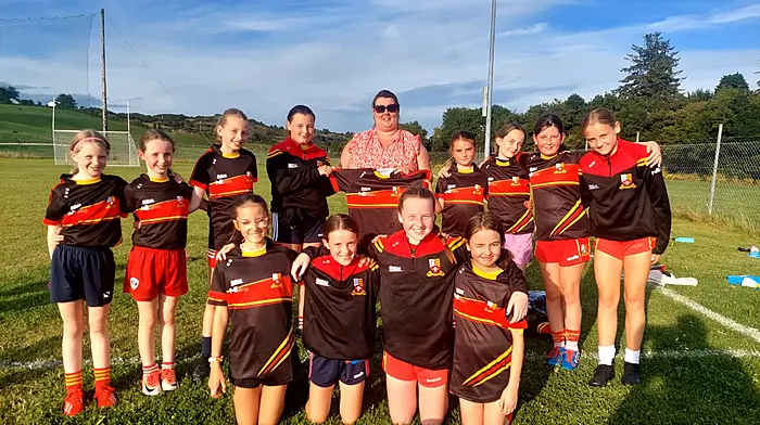 Leah McCarthy, representing Liam McCarthy Construction, presented the Tadhg MacCarthaigh U12 girls with their new training tops and half zips, which they very kindly sponsored.  Back (from left) Emma McCarthy, Kate Lynch, Aoife Barrett, Allie McCarthy, Leah McCarthy (Liam McCarthy Construction) Jenny Murray, Aoibheann Harnedy, Katie Needham and Brid O’Driscoll.  Front (from left) Natalia Gajowniczek, Roisin Murnane, Chloe Delaney and Ellen Hurley. Holly Jeffrey Connolly was missing from the photo.