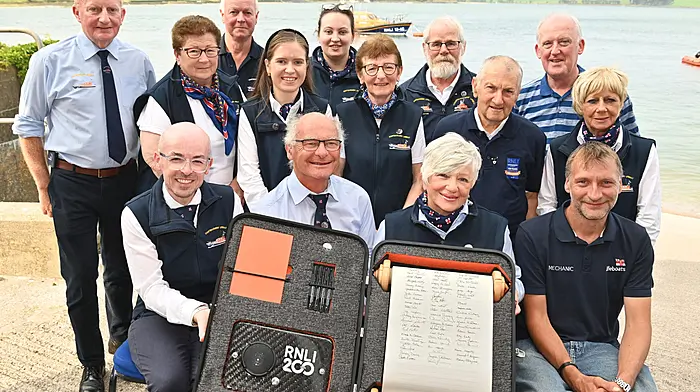 On Sunday a specially commissioned scroll was signed by members of the Courtmacsherry RNLI.  Pictured front are signatories (left to right): Paul Finn (Fundraising), Brian O’Dwyer (Operations), Angela Veldman (Education) and Stuart Russell (Visits). Also included are standing (left to right): Vincent O’Donovan, Martha Drake, David Dunwoody, Fiona O’Regan, Rachel Kelly, Assumpta Drake, Hank Veldman, Diarmuid O’Mahony, Liam Murphy and Joan O’Donovan.  Photo: Martin Walsh.