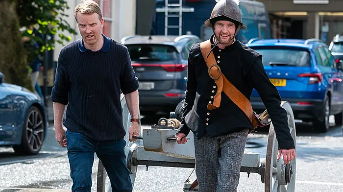 Historian Fergal Phillips from the Kinsale Cultural & Heritage Society and ‘Spanish artillery officer’ Ros Keddy from the Lord Edwards Own re-enactment society, pulling a cannon through Kinsale for a living history display showcasing clothing, weapons, and drills from the Battle of Kinsale as part of the 424th anniversary event for the battle. (Photo: John Allen)