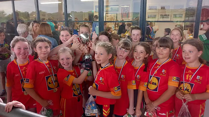 The Tadhg MacCarthaigh U10 girls who won the Eilish Collins memorial cup final in Castlehaven last Sunday are (from left): Hannah Reen, Isobel Cronin, Aine Lynch, Katie Needham, Moire Barry, Aoife Barrett, Aifric Herlihy, Eve Murray, Kaitlyn Collins, Anna Kingston, Ciara Harrington, Vivienne McCarthy, Cadhla O’Regan, Olivia Gajowniczek, Gabriella Dilbaite, Katie O’Sullivan and Siun McCarthy.