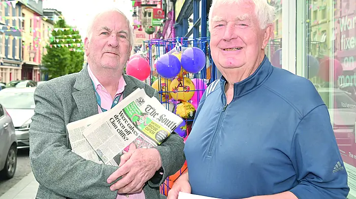 Local gentlemen Kevin Crowley (left) and Colm Quirke recently exchanging the news on Pearse Street, Clonakilty.  (Photo: Martin Walsh)