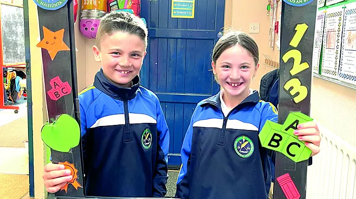 Twins Eli and Evie McCarthy enjoying their return to Lisavaird National School where they will be in third class.