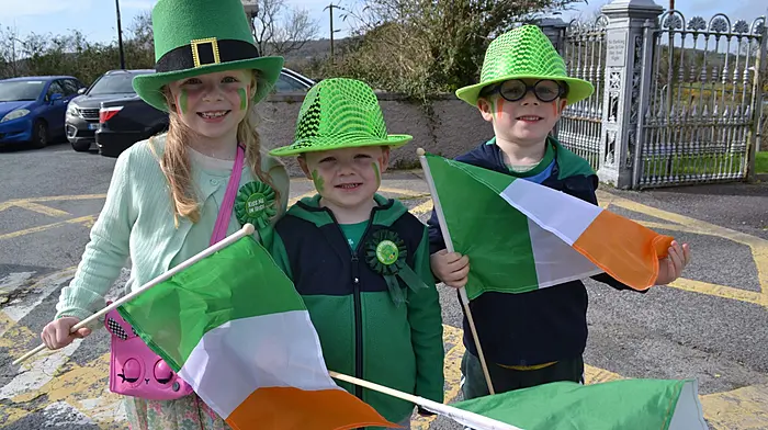 Enjoying the St. Patrick's Day parade in Skibbereen were Emma, Daniel and James O'Sullivan. Right: Claire McCarthy, Zara Williamson and Chloe Cahalane, Tragumna at the Skibbereen parade. Left: John and Lydia Russell and children Oliver, Henry and Emilie enjoying the parade in Schull. (Photos: Anne Minihane & Carlos Benlayo)