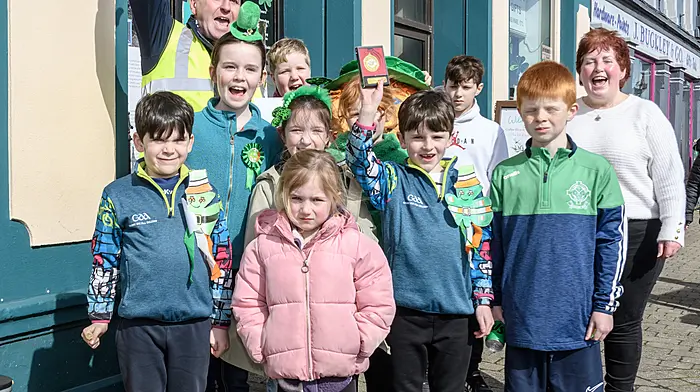 Tim Buckley, chairman of Dunmanway Chamber of Commerce,  presented Togher National School with the prize for best group/float at the Dunmanway St Patricks Day parade.  Representing the school were Ethan Hurley, Robin Baxendale, Alicia Hurley, Clodagh Cronin, Darragh Hurley, Ciaran O’Farrell, Orlaith O’Farrell, Liam Baxendale, Ari Hyland and school principal Majella Daly.   (Photo: David Patterson)