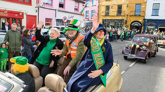 Grand marshal Carmel Murphy of The Well leading the Kinsale parade with Kate French of Kinsale Youth Community Centre and Jim Lyons of Kinsale Men’s Shed.  (Photo: John Allen)