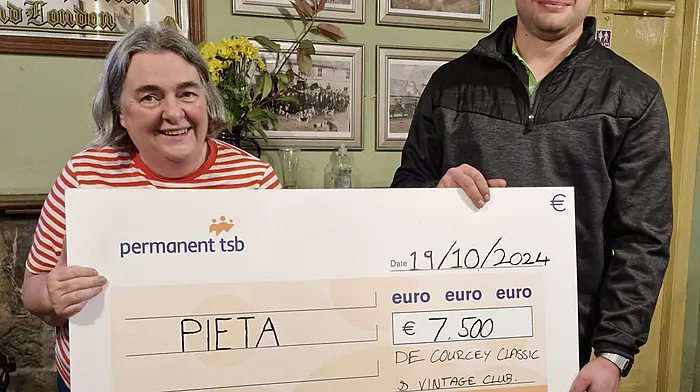 Ann Corcoran accepting a cheque of €7,500 on behalf of Pieta House from Malcolm Shorten of the De Courcey Classic and Vintage Club.