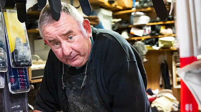 Olan Buckley, Macroom shoemaker, getting ready for a visit from the Tánaiste to Macroom. (Photo: Alison Miles)