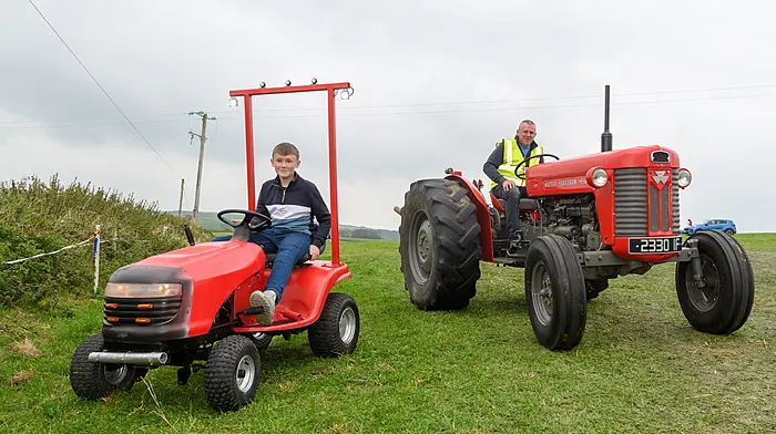Jack and Maurice Collins (Rosscarbery) both driving red tractors (Maurice was driving a Massey Ferguson 65) at Rathbarry and District Vintage Club’s recent tractor, truck, car and motorcycle run which was followed by a classic silage baling and threshing working day at O’Donovan’s Bar, Fishers Cross.  The run this year was held in memory of former club member, Anthony Doolan.   (Photo: David Patterson)