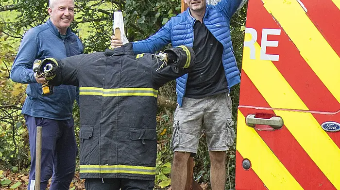 24/10/2024. Leap Scarecrow FestivalFiremen Keith Faithfull and Aidan Whelton from Bandon Fire Service putting up their scarecrow in Leap for the upcoming Scarecrow Festival.Credit: Andrew Harris