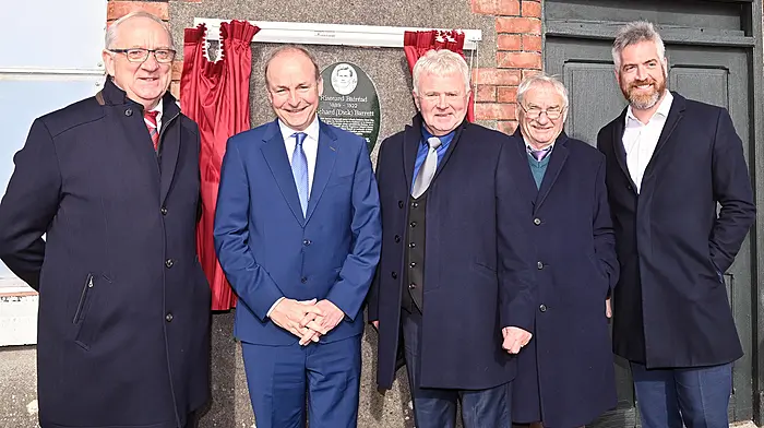 At the unveiling of the plaque on the wall of the old Station House, Ballineen in honour of Dick Barrett were (from left): Finbarr Walsh (Dick Barrett commemoration committee), Tánaiste Micheál Martin, Liam Murphy and Chris Walsh (Dick Barrett commemoration committee) and Christopher O’Sullivan TD. (Photo: Martin Walsh)