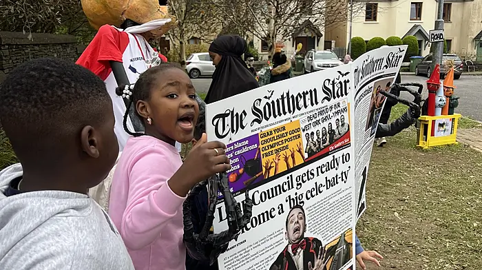 Isaac Olamide Dada and Diamond Kanyinsola Ojo from Clonakilty enjoying the Star scarecrow in Leap.
