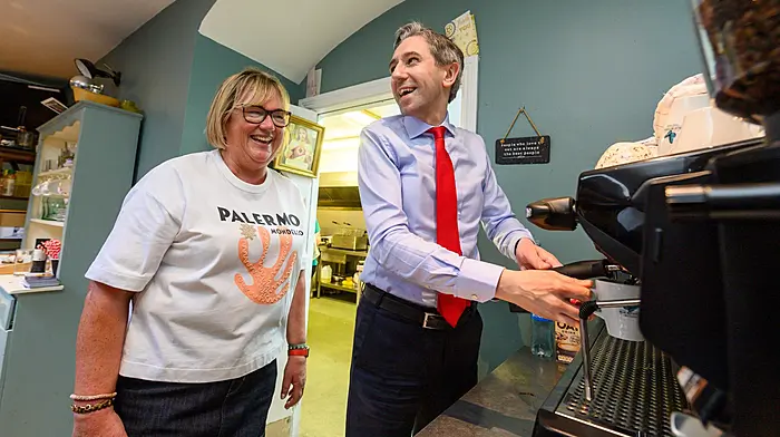 Taoiseach Simon Harris making a coffee with FG Cllr Marie O’Sullivan in her café Salvis, during a visit to Kinsale in May ahead of the local elections (Photos John Allen)