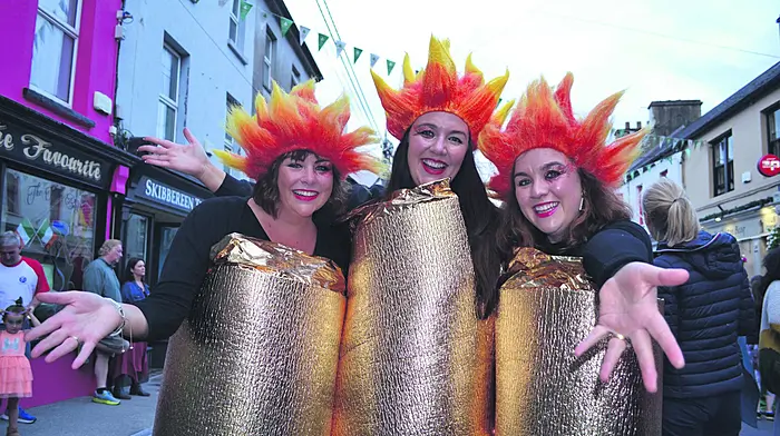Bernadette O’Mahony, Marie Flanagan and Catherine Casey, otherwise known as the O’Donovan sisters from Cork Road in Skibbereen dressed as the Olympic flames at the amazing Olympic Street Party at Skibbereen Arts Festival during the summer. 
(Photo: Anne Minihane)