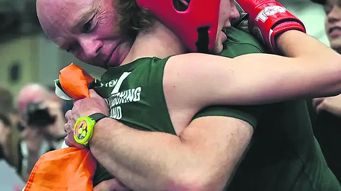 Evan Collins celebrates with his dad Tom Collins after the Skibbereen teenager won gold at the WAKO Youth World Kickboxing Championships in Budapest.