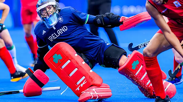 Kinsale’s David Harte makes a save for Ireland against Belgium in their Pool B opener at the Paris Olympic Games. The Irish men’s hockey goalkeeper is now a two-time Olympian. Right: Kinsale captain Jenny Murphy raises the West Cork Ladies Football Perpetual Cup after her team’s victory over Clonakilty in the Drinagh Co-Op Superstores West Cork LGFA Division 1 final in August.