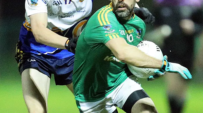 Kilmacabea's Donnacha McCarthy is challenged by Eoin Mangan of Diarmuid Ó Mathúna during the 2024 Bandon Co-op JAFC final. Kilmacabea won 1-12 to 1-4 to record their fourth Carbery junior A football title since 1917.