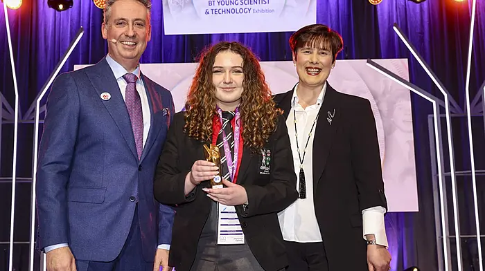 Shay Walsh, managing director, BT Ireland, and Minister for Education Norma Foley TD, presenting the runners-up (individual) award to Philippa McIntosh from Bandon Grammar School for her project on maths and dyslexic students at the BT Young Scientist of the Year competition in Dublin in January.