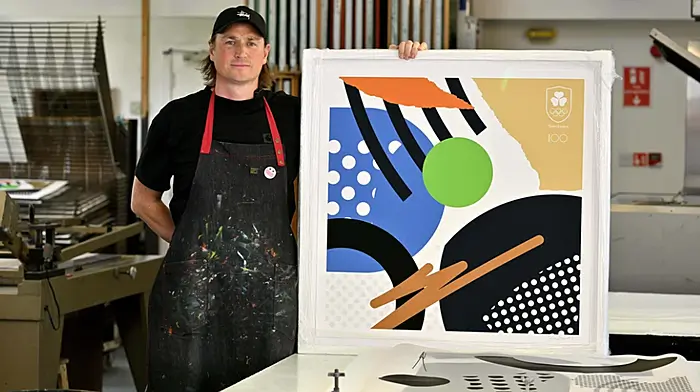 Local artist Shane O’Driscoll with his Team Ireland Olympic centenary print. He was the artist in residence for Team Ireland at the Paris Olympics in July.