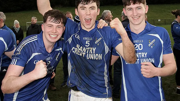 Bantry Blues captain Dara McCarthy with John Crowley and David Shiels Jnr after their victory over Ibane Gaels in the Carbery U21A Football Championship final in February.