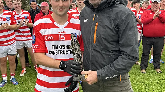 Adrigole sharpshooter Cormac Carey received his man-of-the-match award from Conor Twomey of Twomey’s Bar after inspiring his club to Beara junior B football final glory in October. Carey scored 3-3 in Adrigole’s 4-11 to 1-9 win over Glengarriff.