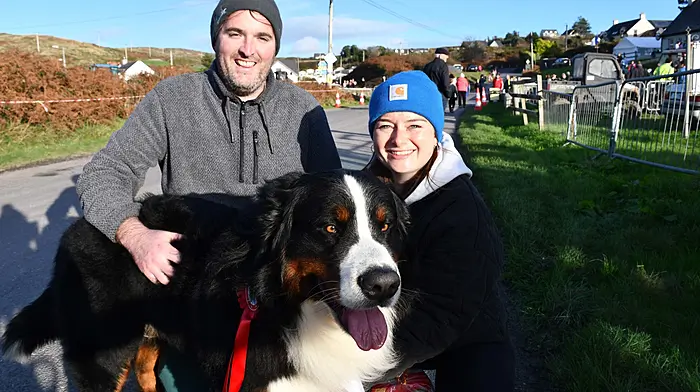Rob O'Leary and Izzy Walsh from Baltimore with the lovely Sandy, their Bernese mountain dog, enjoying the sunshine at Tragumna threshing last Sunday afternoon. (Photo: Anne Minihane)