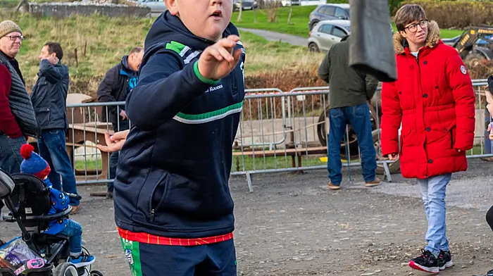 The annual old time threshing event in Tragumna, West Cork took place today at the Skibbereen Eagle pub car park. Hundreds of people attended the event which was held in aid of local charities. Trying his hand at welly wanging was Shane Duggan from Skibbereen. Picture: Andy Gibson.
